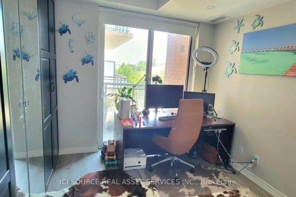 Home office with desk, dual monitors, ring light, and artwork - 301 - 11611 Yonge Street Richmond Hill