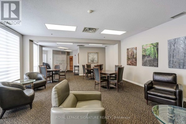 Leather armchairs, glass tables, dining tables, and wall art - 301 - 483 Faith Drive Mississauga