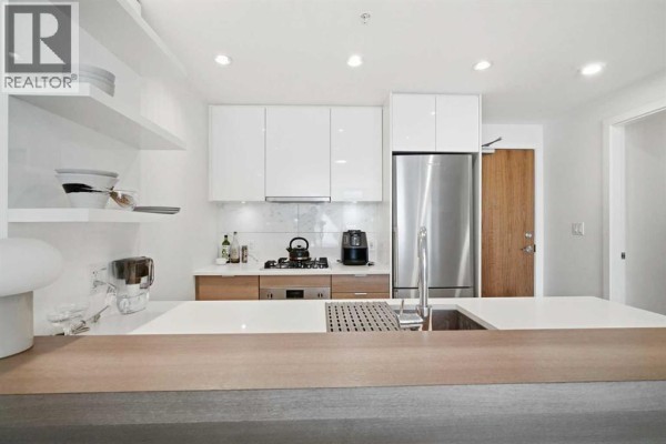 Living room - 303, 138 Waterfront Court Sw, Calgary, AB T2P1L1 Photo 5