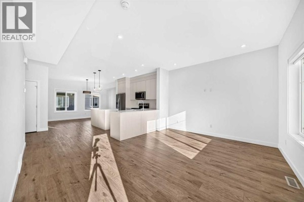 Living room - 303, 6 Merganser Drive W, Chestermere, AB T1X2Y2 Photo 2