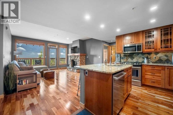 Eat in kitchen - 303, 701 Benchlands Trail, Canmore, AB T1W3G9 Photo 3
