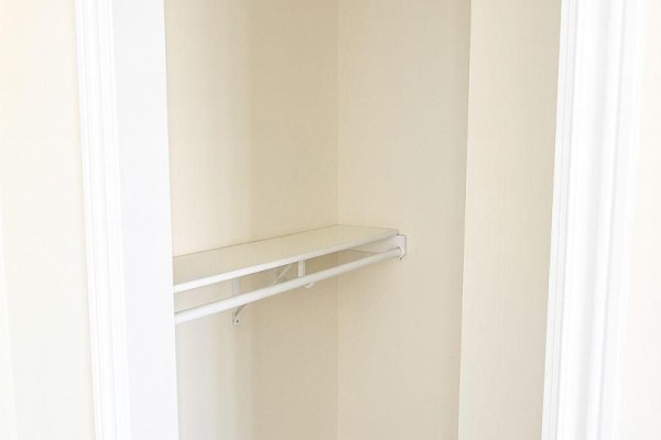 Empty closet with one shelf and a clothing rod. - 303 - 198-200 Queen Street W, Toronto