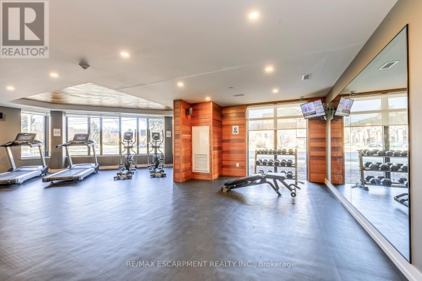 Gym with treadmills, ellipticals, weights, and mirrors - 303 - 320 Plains Road E Burlington