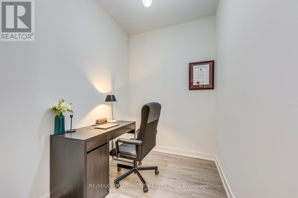 Office with desk, chair, lamp, laptop, framed certificate - 303 - 320 Plains Road E Burlington