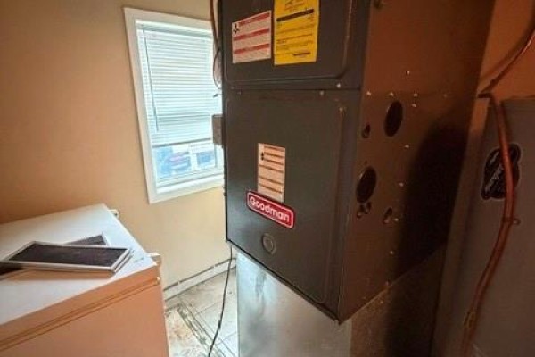 Furnace, AC unit, and freezer in laundry room - 303 Wellington Street West Chatham