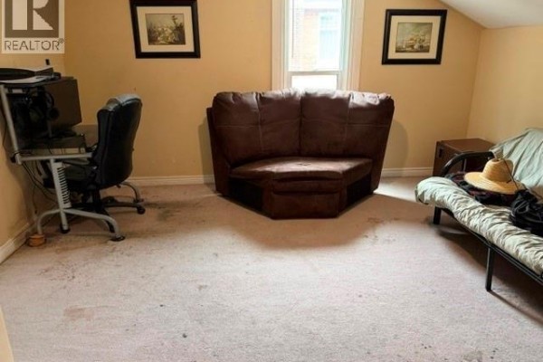 Office desk, sectional sofa, and daybed - 303 Wellington Street West Chatham