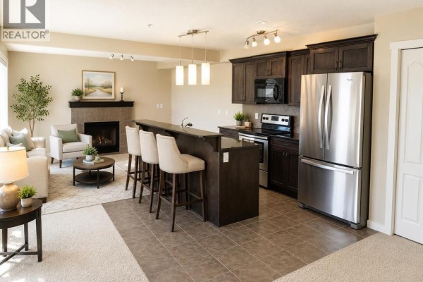 Living room - 304, 141 Mountain Street, Cochrane, AB T4C1Z5 Photo 4