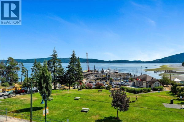 Waterfront view from apartment showing park, marina, and the blue ocean. - 304 1533 Joan Ave, Crofton
