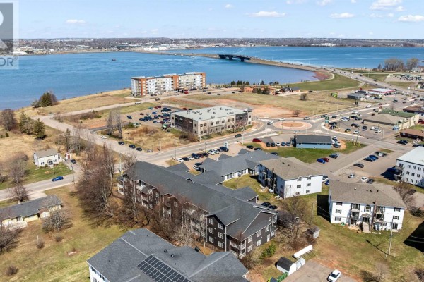 Aerial view of apartment buildings near a body of water and bridge. - 304 29 Stratford Road, Stratford