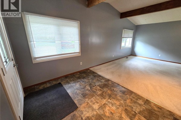 View of the living room highlighting furniture arrangement and natural light - 304 Second Avenue E, Lampman