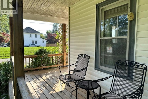 Front porch with chairs and table - 305 North Cayuga Street W Dunnville
