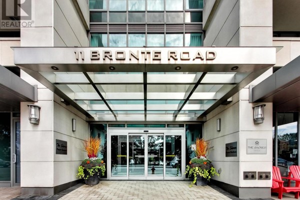 Detailed view of the entrance canopy and automatic glass doors at 11 Bronte Road. - 306 - 11 Bronte Road, Oakville