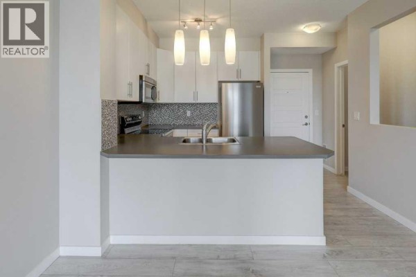 Dining room - 307, 207 Sunset Drive, Cochrane, AB T4C0H7 Photo 4