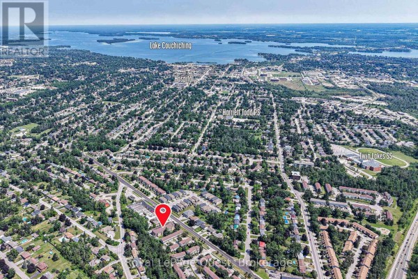 Aerial overview of Orillia with the apartment building location marked. - 307 - 1047 Mississaga Street W, Orillia