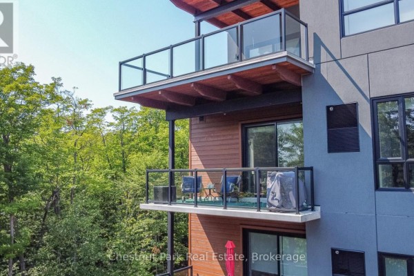 Balcony views from apartment with seating and a grill. - 307 - 20 Campus Trail, Huntsville