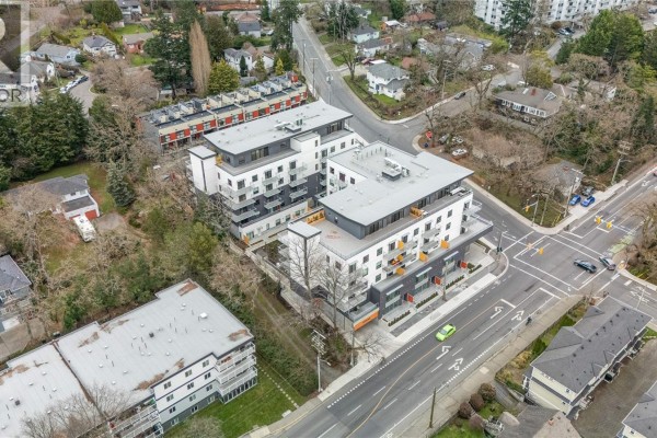 Aerial view showcasing the building layout and nearby streets with parked cars - 307 1102 Esquimalt Rd, Esquimalt
