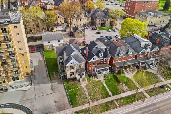 Aerial view of a row of attached houses including 307 Central Avenue. - 307 Central Avenue, London East