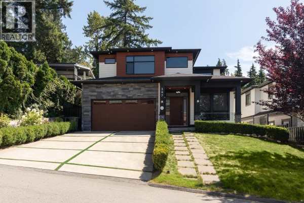 Covered balcony with glass railings and dark wooden ceiling, overlooking the residential street. - 307 Cutler Street, Coquitlam