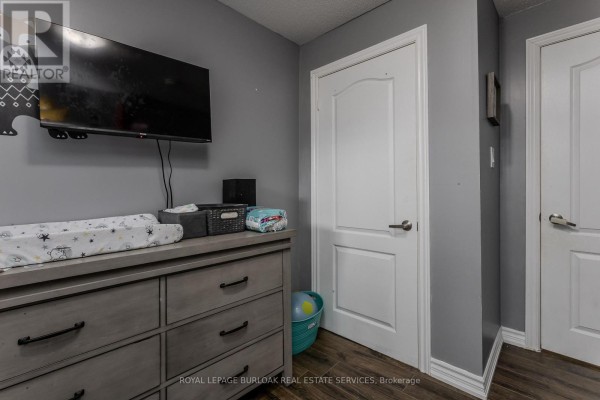 Dresser with changing pad and TV, two doors - 307 Dunsmure Road Hamilton