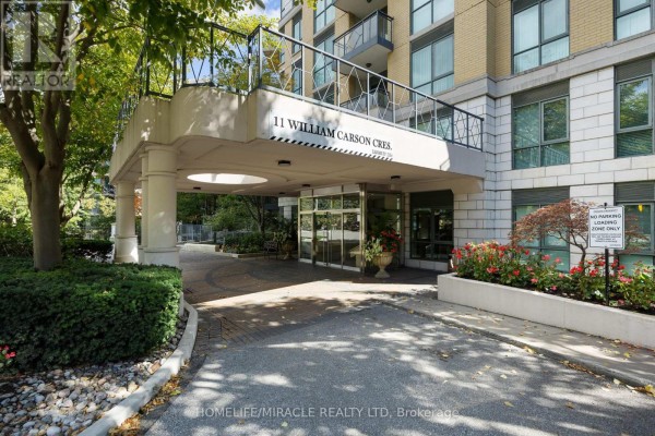 Covered entrance with pillars and glass doors at 11 William Carson Crescent. - 308 - 11 William Carson Crescent, Toronto