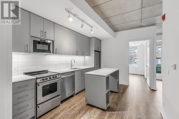 Living room - 308 - 115 Larchmount Avenue, Toronto, ON M4M2Y6 Photo 2