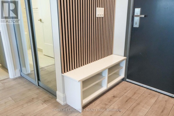 Large communal space with panoramic windows, seating areas, and a kitchen island. - 308 - 8 Water Walk Drive, Markham