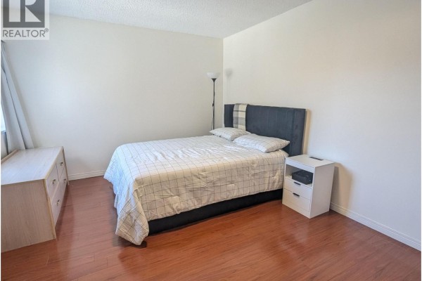 Floor plan of a 2-bedroom apartment showing room dimensions and layout. - 308 7428 19th Avenue, Burnaby