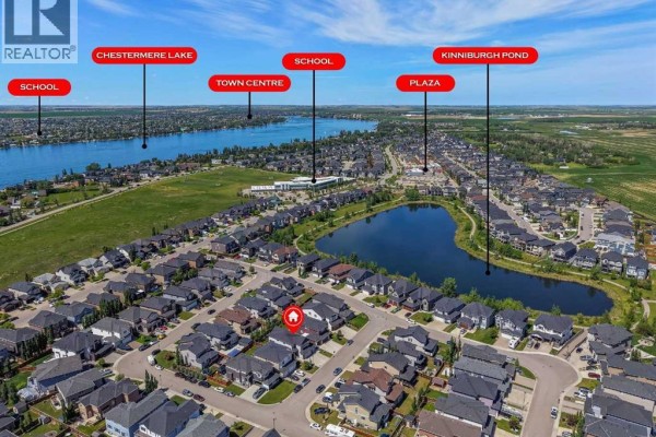Aerial view of a Chestermere neighborhood showing proximity to Chestermere Lake, Kinniburgh Pond, and town amenities. - 308 Kinniburgh Link, Chestermere