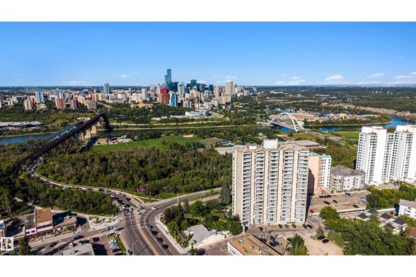 Aerial view of the apartment building with the Edmonton skyline, North Saskatchewan River, and bridges. - #309 10883 Saskatchewan Dr Nw, Edmonton