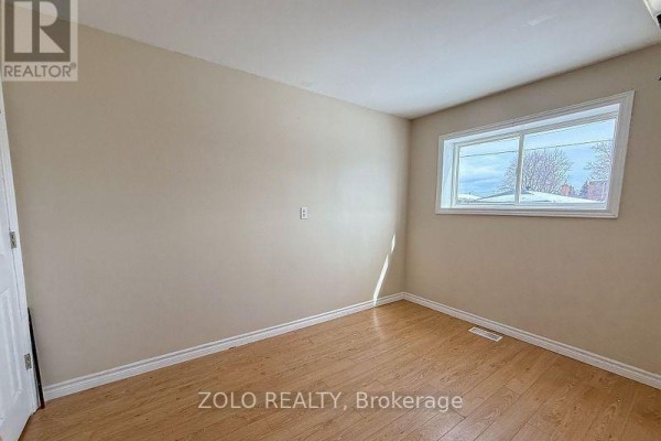Bathroom with a bathtub, showerhead, and tiled flooring - 309 Cedar Street N, Timmins