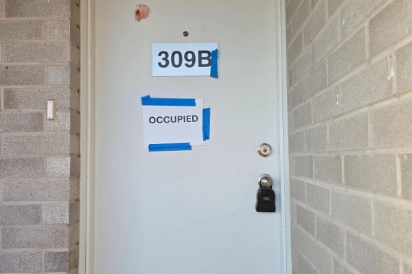 Front door labeled 309B with an 'OCCUPIED' sign taped over a lower sign. - 309b - 16 Melbourne Avenue, St  Catharines