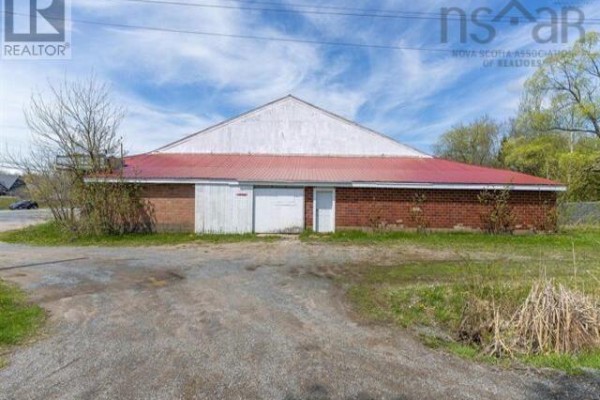 Front view of storage facility with signage and garage door - 31 Highway 277, East Hants