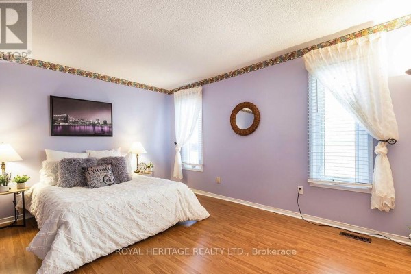 Kitchen with wood cabinets, double sink, microwave, and dishwasher - 31 Thames Drive N Whitby