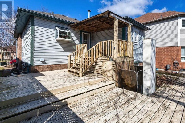 Wooden deck with covered porch and elevator lift - 31 Thames Drive N Whitby