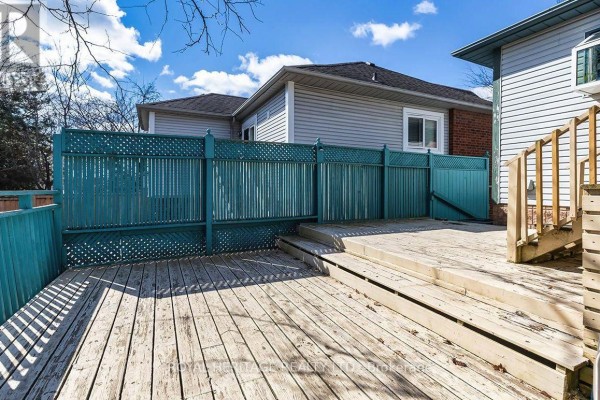 Wooden deck and teal fence - 31 Thames Drive N Whitby