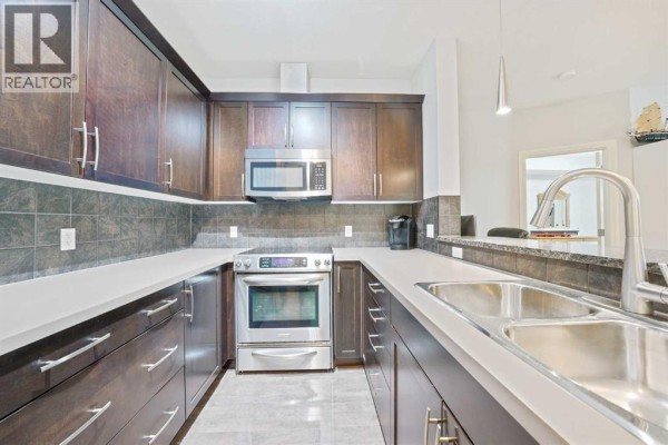 Dining room - 3104, 15 Sunset Square, Cochrane, AB T4C0E7 Photo 4