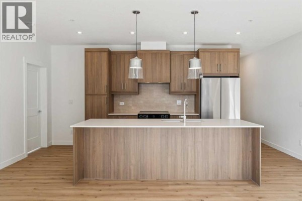 Living room - 3107, 3700 Seton Avenue Se, Calgary, AB T3M4K4 Photo 3