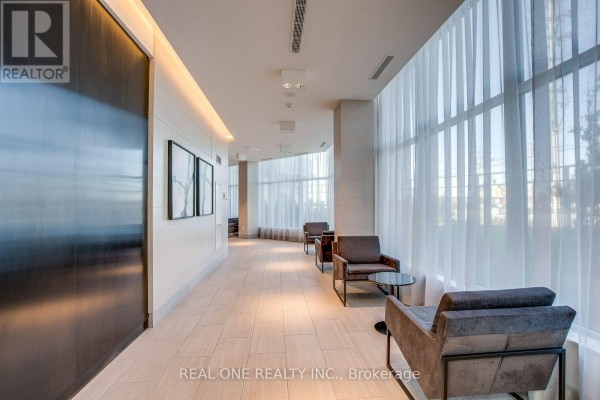 Hallway with seating area, chairs, glass tables, and large windows with sheer curtains. - 311 - 4633 Glen Erin Drive, Mississauga