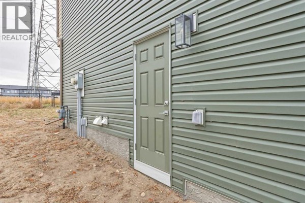 2pc Bathroom - 311 Dawson Dock Way, Chestermere, AB T1X2W4 Photo 4