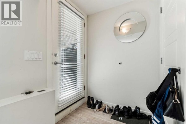 Living room - 312, 260 Rowley Way Nw, Calgary, AB T3L0H5 Photo 2