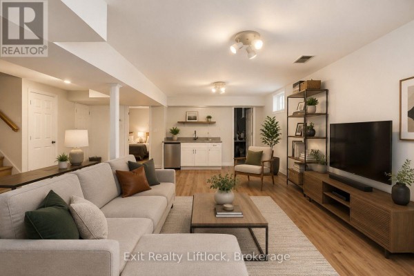 Living room with kitchenette and sofa - 3133 Frances Stewart Road Peterborough