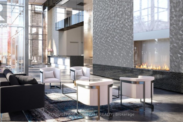 A modern lobby with a large fireplace, seating area, and high ceilings. - 314a - 11782 Ninth Line, Whitchurch Stouffville