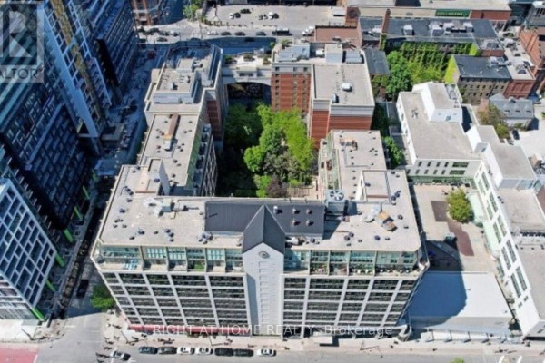 Aerial view of a U-shaped apartment building with a central courtyard and surrounding city structures. - 315 - 222 The Esplanade, Toronto