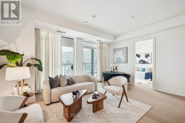 Open concept living area with sofa, chairs, coffee table, and a view of the bedroom. - 315 - 399 Royal Orchard Boulevard, Markham