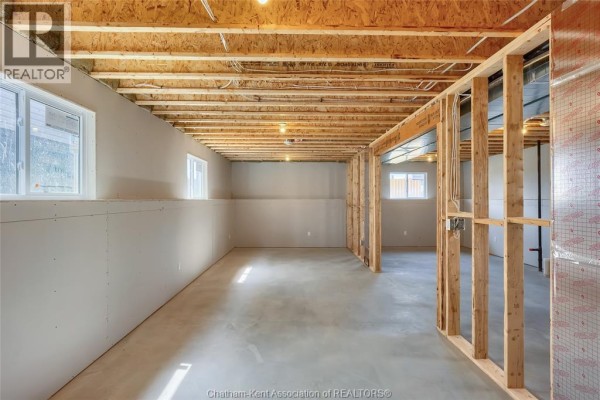 Unfinished basement with framing, drywall, and windows - 315 Ironwood Trail Chatham