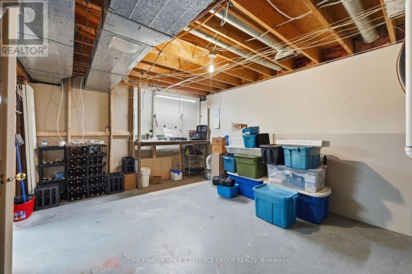 Basement with wine rack, workbench, and storage bins - 3160 Dunning Road Ottawa