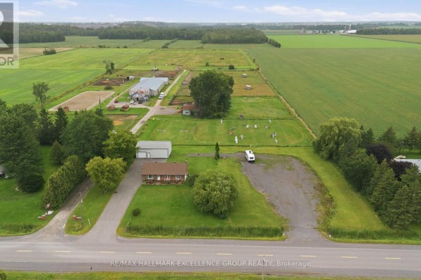 Aerial view of rural property with house, garages, riding arena, outbuildings and fields - 3160 Dunning Road Ottawa