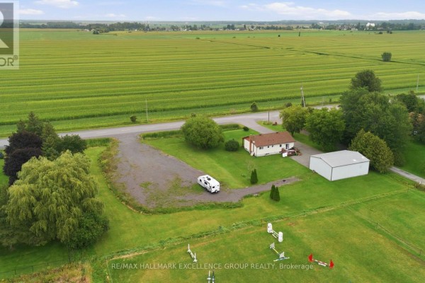 House with RV and outbuilding next to farm fields - 3160 Dunning Road Ottawa