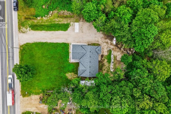 Aerial view of home with new roof, deck, and surrounded by trees - 316040 6 Highway Chatsworth