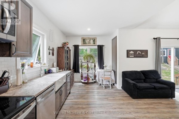 Kitchen with farmhouse sink, subway tile, and sofa - 316040 6 Highway Chatsworth